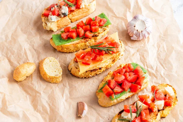 Italian bruschetta with cheese and tomatoes — Stock Photo, Image