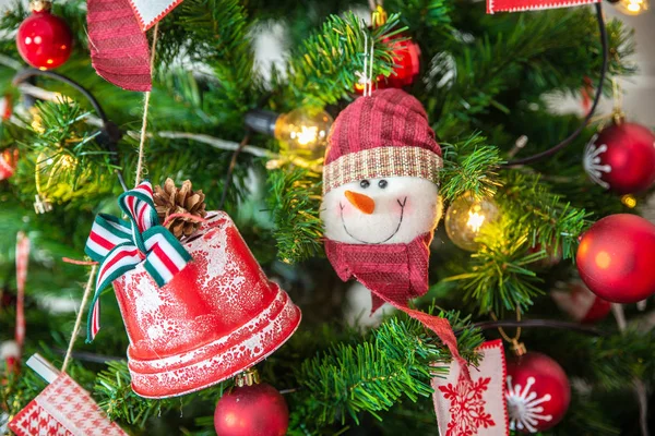 Toy Christmas snowman on Christmas tree — Stock Photo, Image