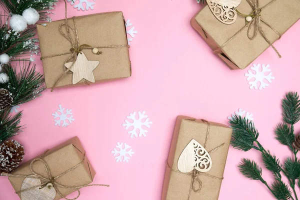 Craft gifts with fir twigs on a pink background flatlay — Stock Photo, Image