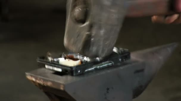 Man breaks the hard drive with a sledge heavy hammer, on the anvil. Slow motion Close-up have sound — Stock Video