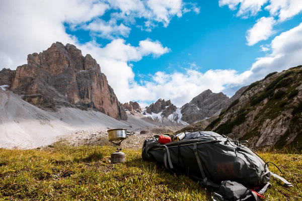 Camping gas and backpack on Alps background — Stock Photo, Image