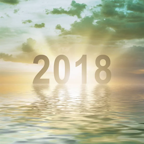 Ano Novo 2018 dígitos texto pôr do sol desfoque fundo — Fotografia de Stock