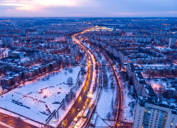 Aerial city winter view with crossroads and roads, houses, buildings, parks. Helicopter drone shot. Wide Panoramic image. Kharkiv, Ukraine