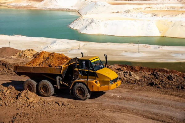 Big truck works at sand quarry