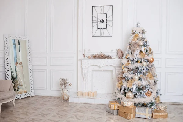 White and gold christmas fireplace interior