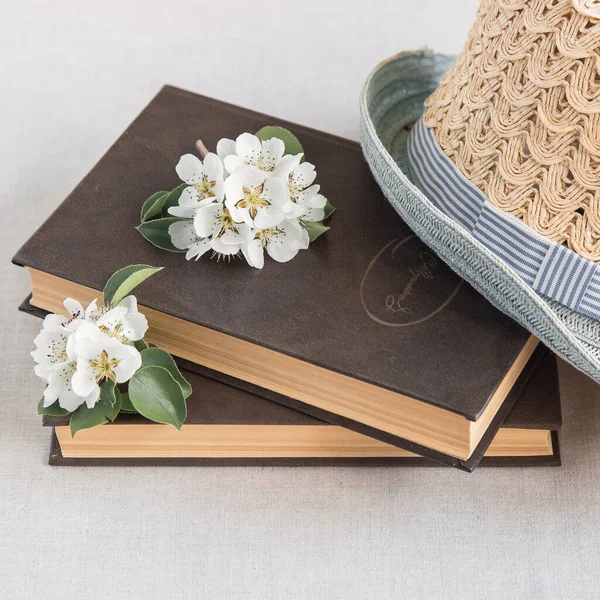 Blossom Pear Bouquet Glass Jar Straw Hat Brown Old Books — Stock Photo, Image