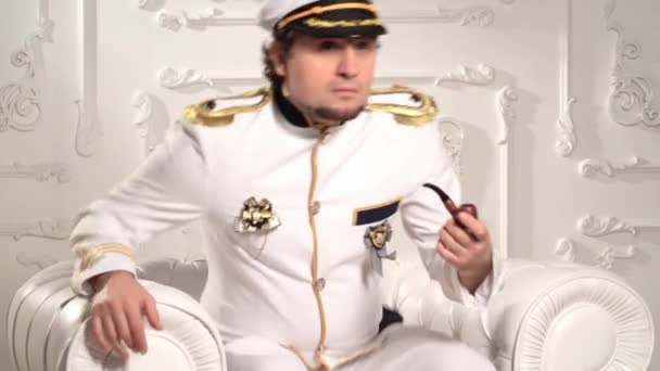 Sea Captain White Uniform Suitable Chair Sits Smokes Pipe Welterweight — Stock Video