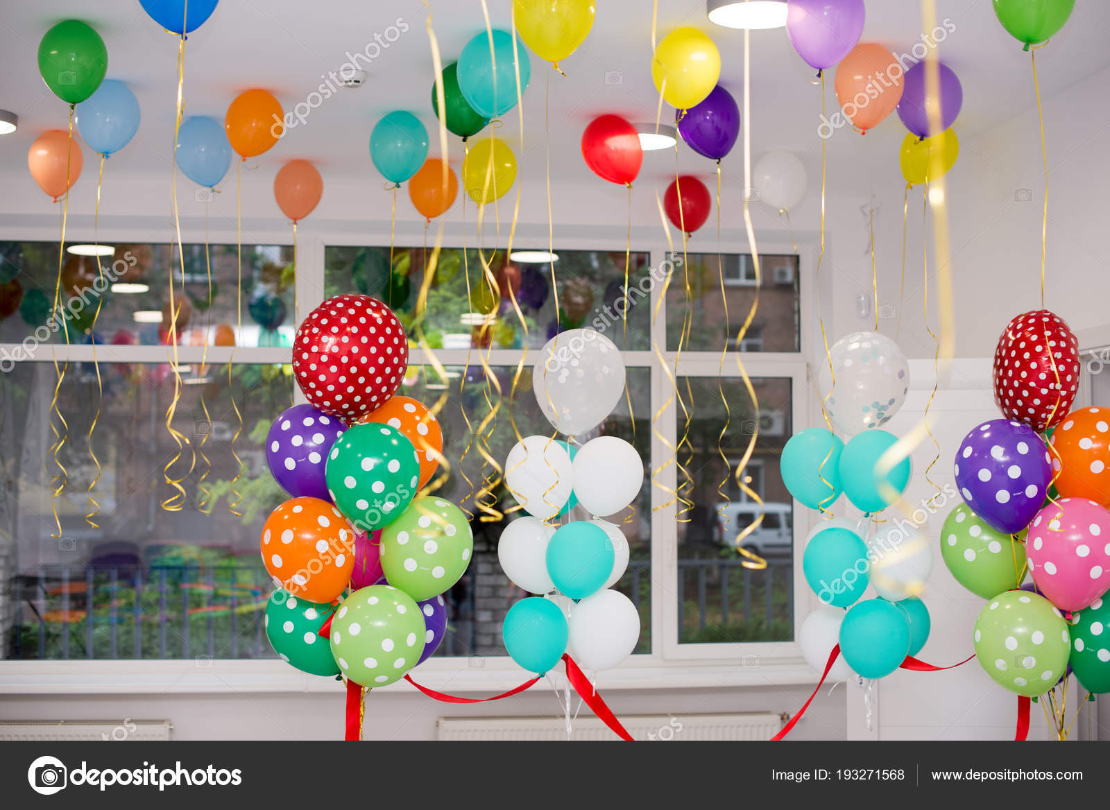 Colorful Balloons Hang Under The White Ceiling Stock
