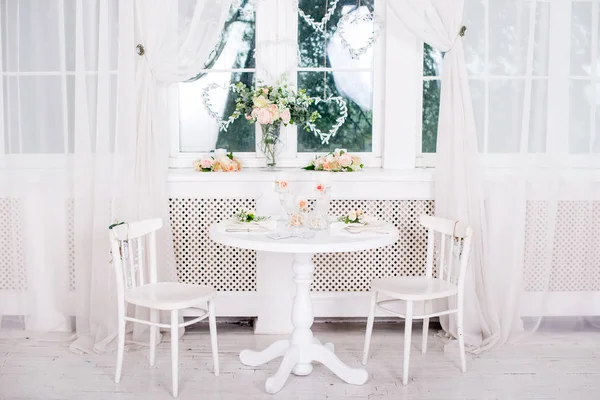 Banquet decorated table, with cutlery. Wedding decor in the banquet hall.Serving of a festive table, plate, napkin, knife, fork. Table setting decoration. Romantic Dinner or other events