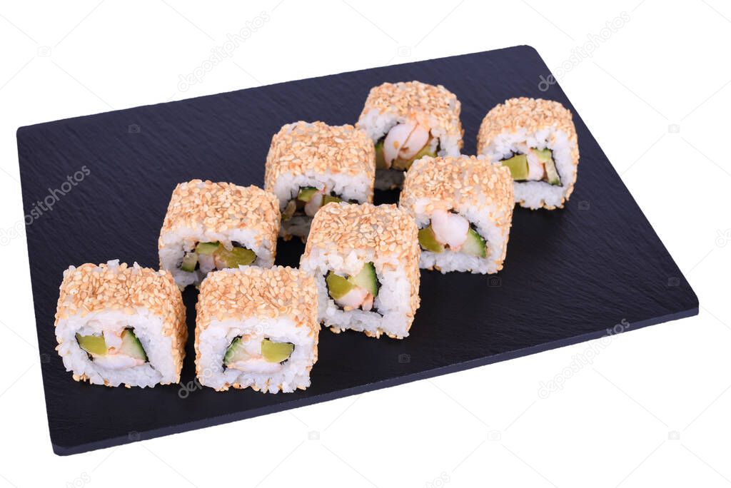 Traditional fresh japanese sushi rolls on a black stone Yokohama on a white background. Roll ingredients: tiger shrimp, daikon radish, cucumber, spicy sauce, nori, rice, white sesame