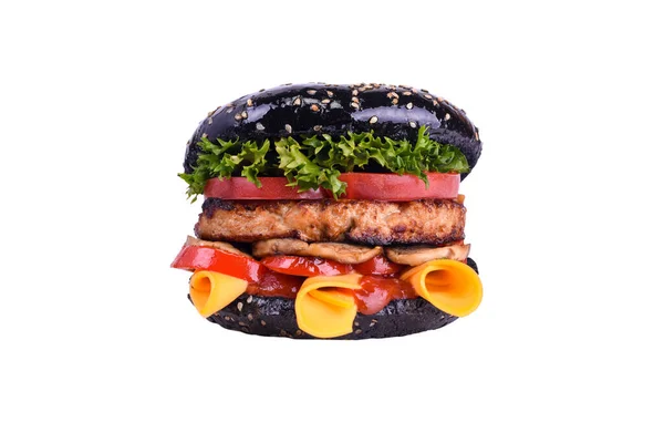 Black burger with pork and beef meat, cheddar, mushrooms, tomatoes, bell pepper, lettuce mix, BBQ sauce isolated on a white. — Stock Photo, Image