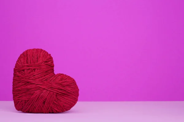 Warm heart of red wool yarn