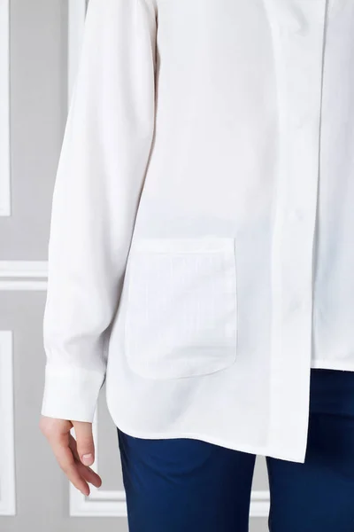 White asymmetrical shirt on model