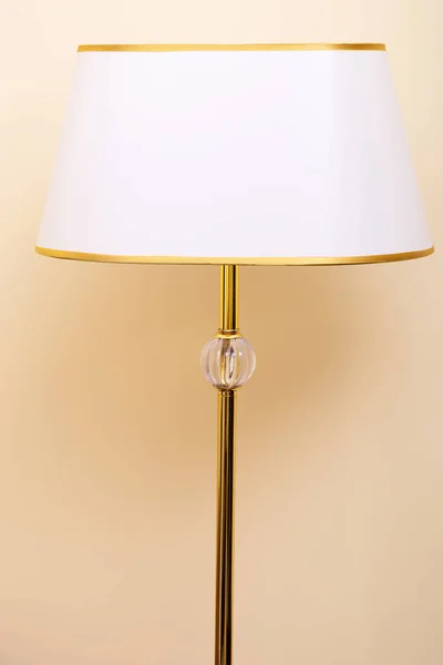 Floor lamp on beige background