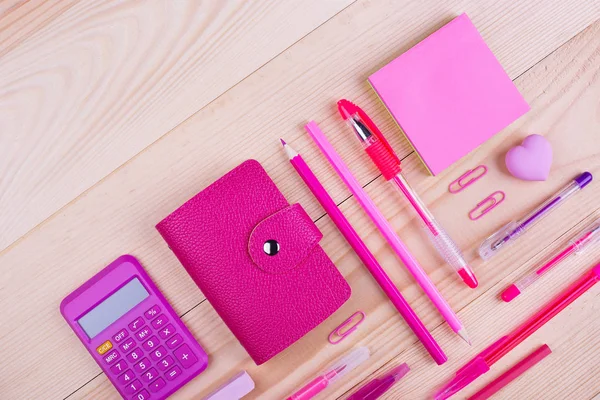 Pink notebook and office supplies