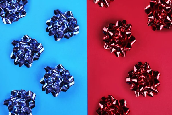 Bright red and blue bow on a colored background