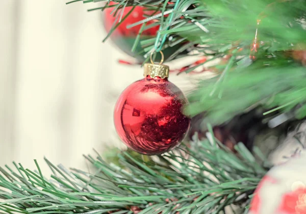 Red globe ornament, Christmas tree, pine close up