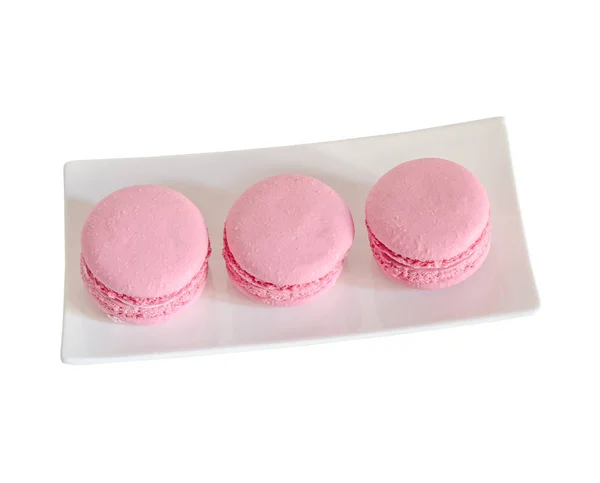 Macaroons doces rosa, francês tradicional, creme, prato branco — Fotografia de Stock