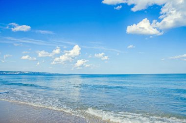 Blue sky with fluffy clouds, over clear sea water,  beach sands, clipart