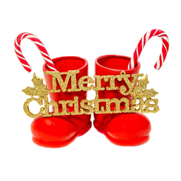 Chaussures Santa Rouge avec bâtons de bonbons et Joyeux Noël doré — Photo