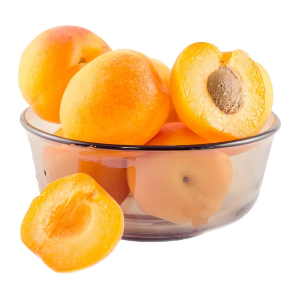 Yellow orange apricots in transparent vase, isolated background, — Stock Photo, Image