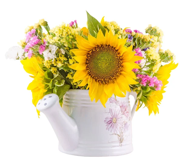 Yellow sunflowers and colored wild flowers in a white sprinkler,