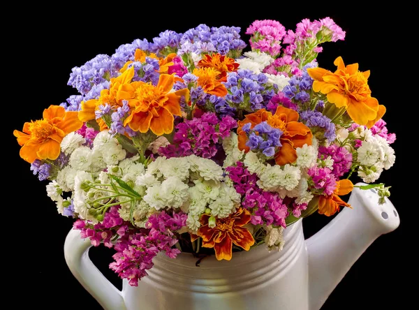 White ceramic watercan, sprinkler, with vivid colored flowers — Stock Photo, Image