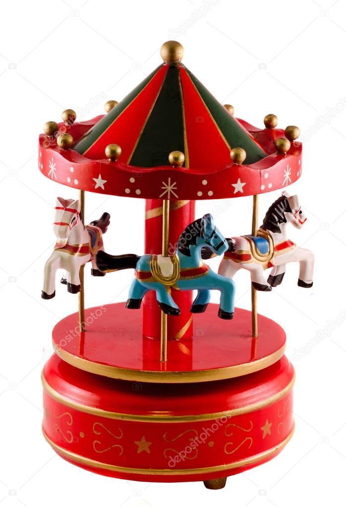 Colored carousel toy with horses, close up, isolated, white back