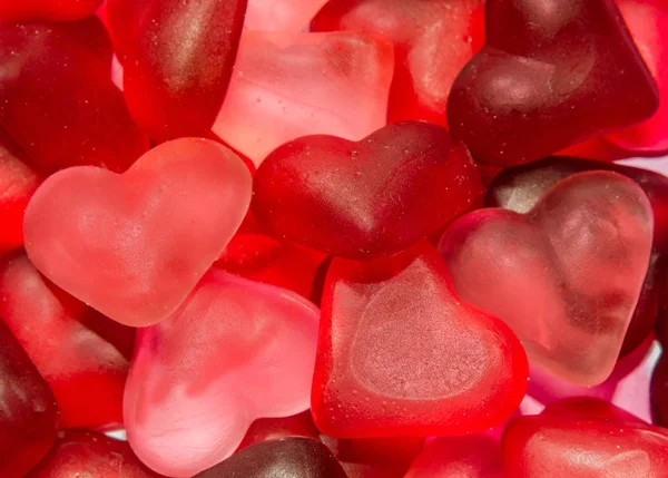 Barevné (růžová, červená a oranžová), transparentní srdce tvar želé, — Stock fotografie