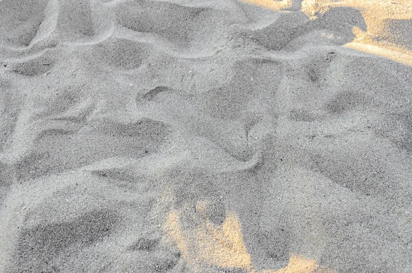 Золотой пляжный песок, текстура фона — стоковое фото