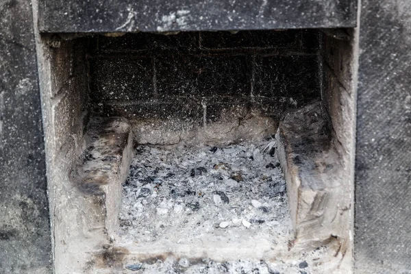 Ash and coals in a street stone grill — 스톡 사진