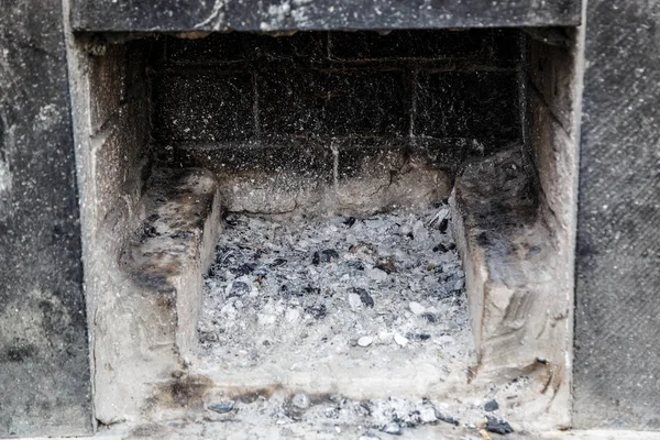 Ash and coals in a street stone grill — 스톡 사진