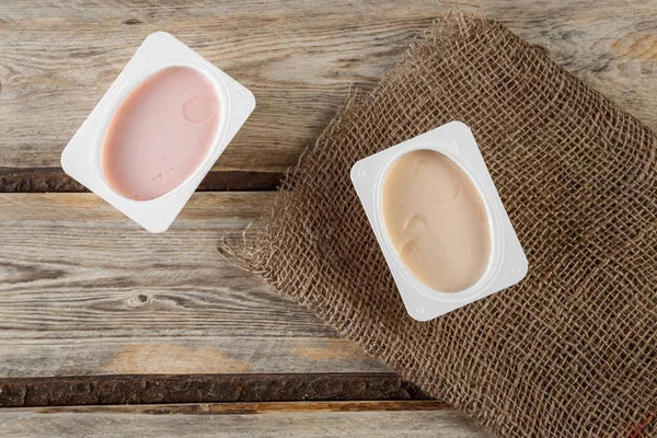 natural organic yogurt with natural juice on a wooden background