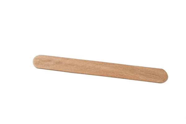 Sterile disposable eco friendly wooden medical spatula designed for inspection of the mouth and throat on a white isolated background — 스톡 사진