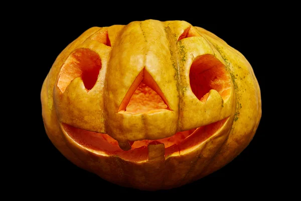 Cadılar Bayramı Balkabağı bir mum içinde. siyah arka plan üzerine