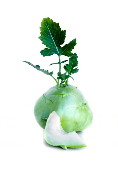 Fresh kohlrabi with a bited piece and green leaves on isolated white backround — Stock Photo, Image