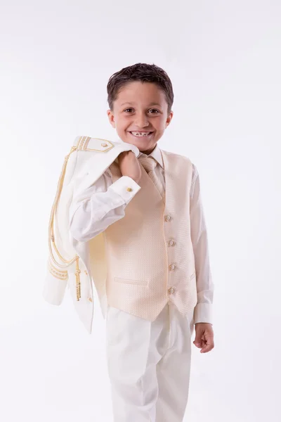 Young boy smiling with his jacket over his shoulder — Stock Photo, Image