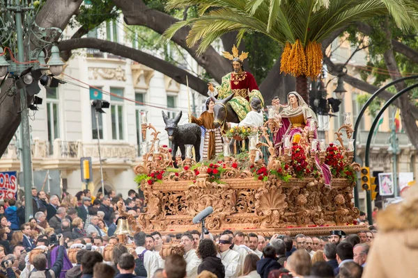 Heilige Week in Malaga, Spanje. Christus troon in Palmzondag processie. Rechtenvrije Stockfoto's