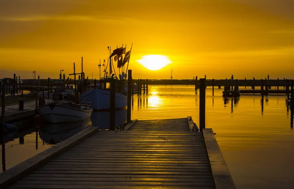 Sunset at the old harbor. — Stock Photo, Image