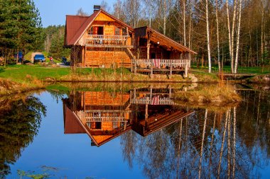 Home reflection in lake clipart