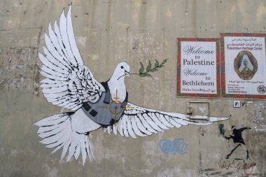 Jerusalem, Israel - 12/15/2019: graffiti on the wall between border of Israel and Palestine, some of them by Banksy