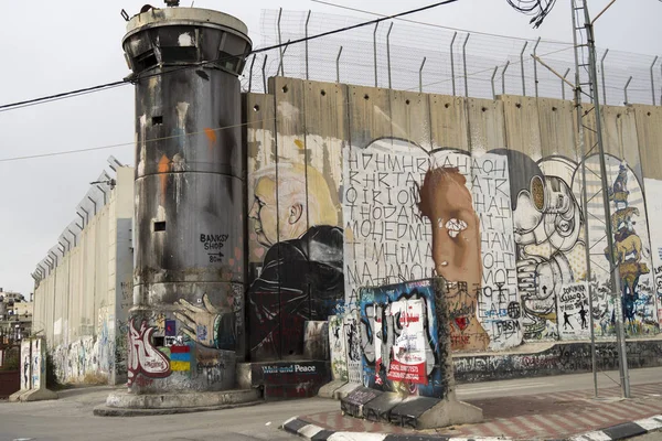 Jerusalem, Israel - 12/15/2019: graffiti on the wall between border of Israel and Palestine, some of them by Banksy