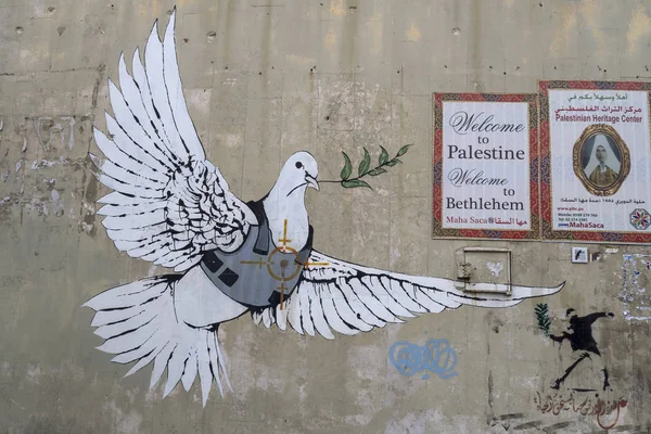 Jerusalem, Israel - 12/15/2019: graffiti on the wall between border of Israel and Palestine, some of them by Banksy