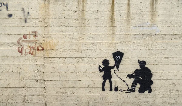 Jerusalem, Israel - 12/15/2019: graffiti on the wall between border of Israel and Palestine, some of them by Banksy