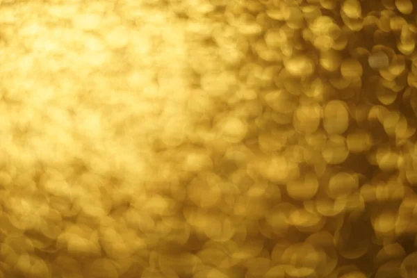 Ouro brilhante fundo, ouro brilhos desfocado fundo . — Fotografia de Stock