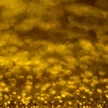 Altın sarısı parlak arkaplan, altın parıltılar bulanık arkaplan.