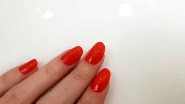 Red Nails Classic Manicure Female Hand White Surface Water Spa — Stock Video