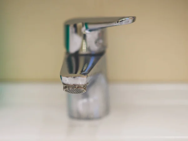 Chrome faucet in the bathroom closeup, selective focus. — Stock Photo, Image