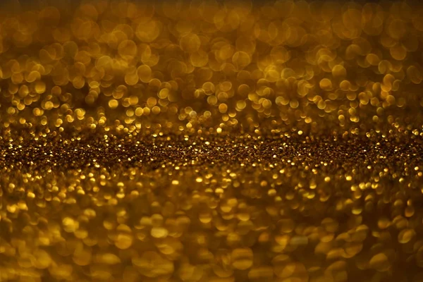 Złoty brokat błyszczące tło, złota konsystencja błyszczy. — Zdjęcie stockowe