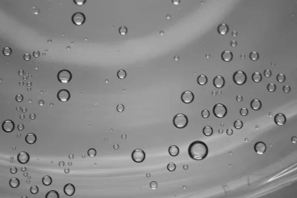 Round water drops on wet grey background — 스톡 사진